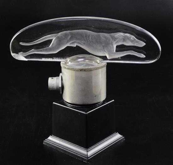 Levrier/Greyhound. A glass mascot by René Lalique, introduced on 14/3/1928, No.1141 Height with mount 10.5cm. overall 17.5cm.